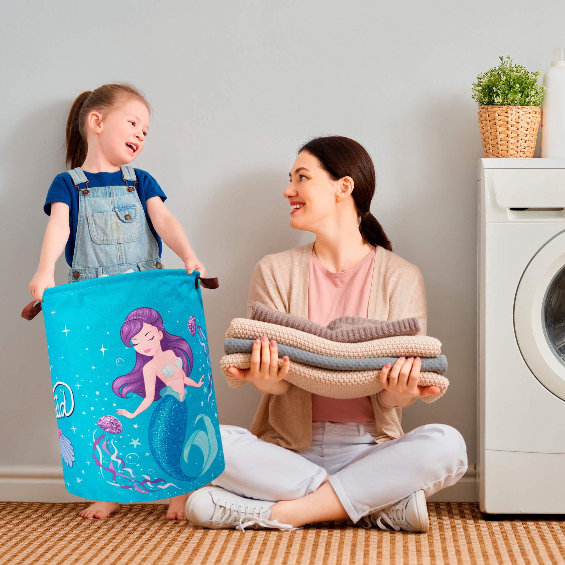 A fun and practical mermaid-themed laundry hamper designed for kids’ rooms, featuring a vibrant underwater design with a cute mermaid. Made of lightweight, collapsible fabric with sturdy leather handles for easy carrying. Perfect for storing laundry, toys, and clothes in bedrooms, playrooms, or bathrooms. Khelo exclusive.