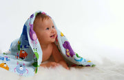 A super-soft and absorbent organic cotton baby towel featuring an adorable cartoon animal design. Made from 100% organic cotton, this lightweight and breathable towel is perfect for keeping babies warm and cozy after bath time. The ultra-gentle fabric ensures comfort on delicate skin, while its high absorbency quickly dries moisture. Designed for newborns and infants, this fun and colorful towel adds a touch of joy to bath time, making it an ideal baby shower gift or everyday essential for parents.