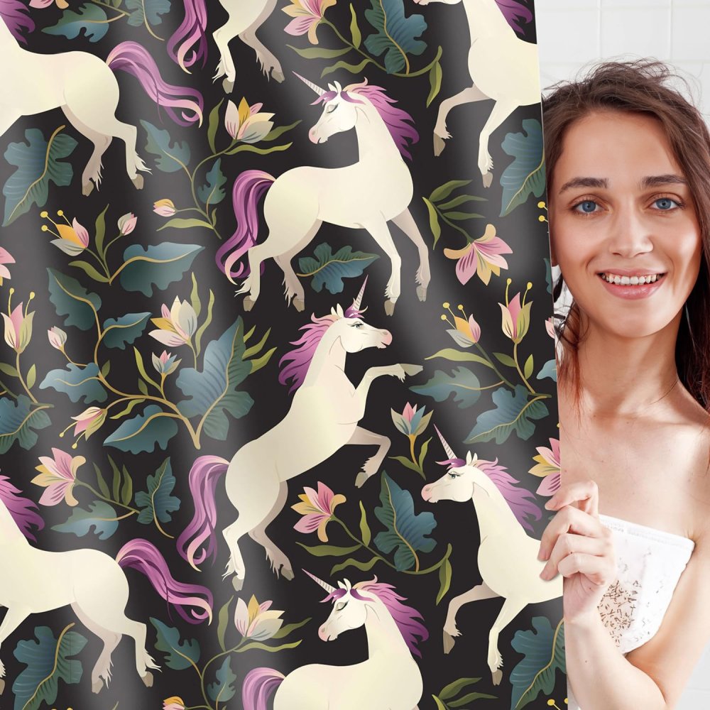 Unicorn floral kids shower curtain featuring a whimsical design of white unicorns with pink manes. This shower curtain is surrounded by vibrant flowers and greenery on a dark background. Perfect waterproof shower curtain for a magical kids' bathroom decor as well as for adults.